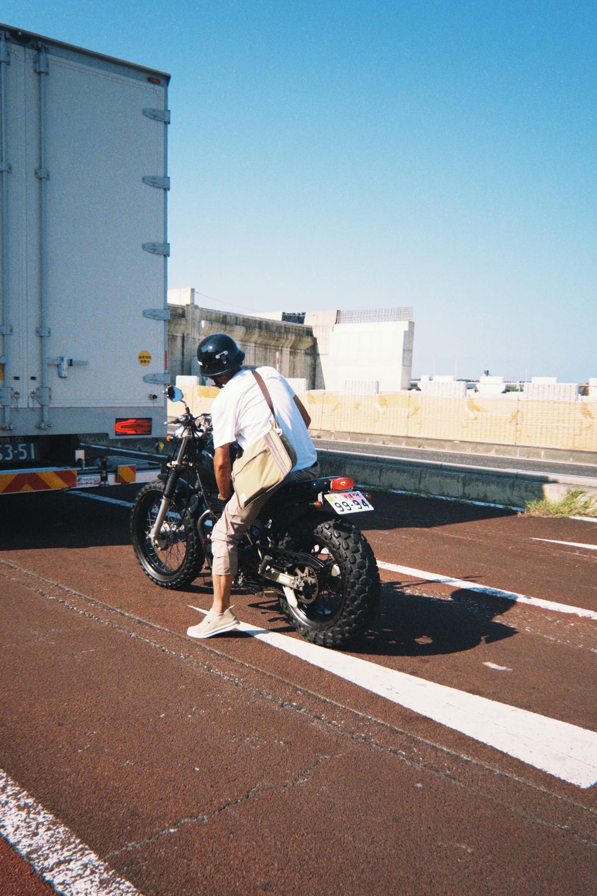 A rider on a scooter on an Okinawa street
