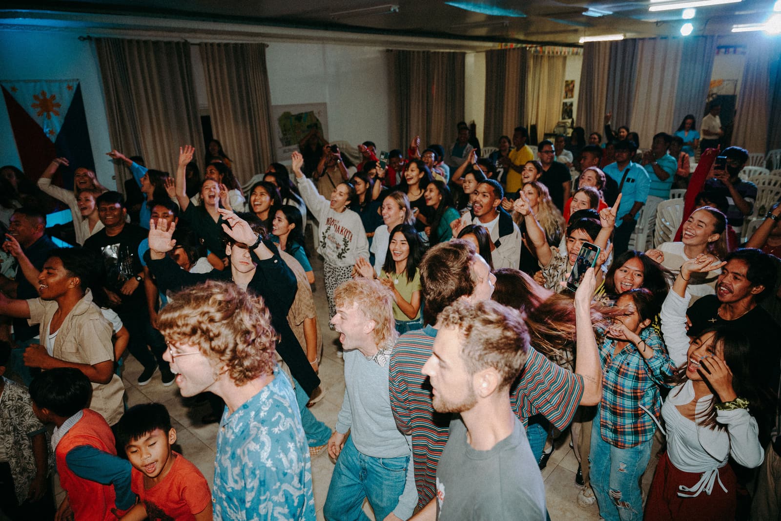 A crowd worshipping together at a Fire & Fragrance Dream Tour gathering in Manila