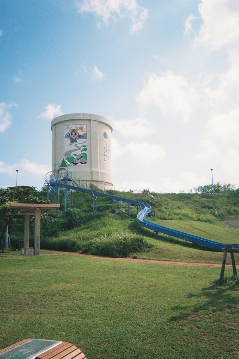 A painted water tower and long roller slide in an Okinawan park